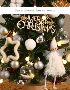 Mini Christmas tree detail with wooden Merry Christmas tag, angel doll and warm LED lights