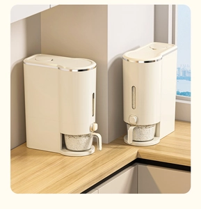 Detail of cream rice dispenser with press button, wood base, and transparent measuring cup
