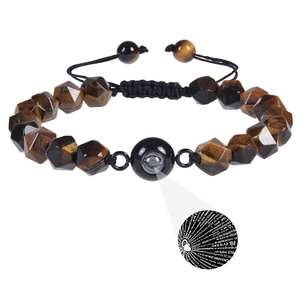 Detailed view of faceted tiger eye beads with 100 languages I love you projection stone