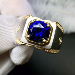 Men's two-tone gold and silver ring with square blue sapphire and screw details