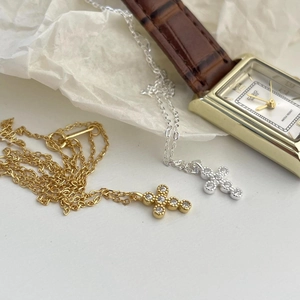 Detailed view of 925 sterling silver cross pendant necklaces in gold and silver finish