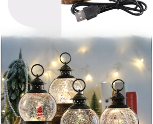 Detail of Christmas lanterns with snow globe scenes and USB power cable connection