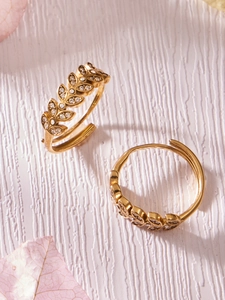 Macro detail of 18K gold plated leaf ring showing intricate zircon pavé setting textures