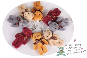 Assorted plush teddy bear pendants with silk ribbons and metal chains in various colors