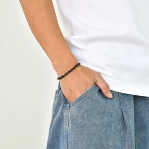 Close-up of black rectangular link chain bracelet worn on wrist for men and women