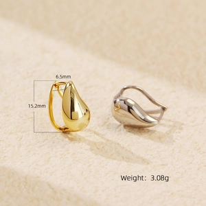 Macro shot showing dimensions and weight of polished teardrop huggie earrings
