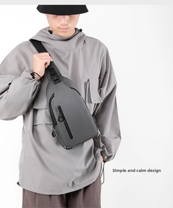 Close-up of matte waterproof chest bag with multiple functional zipper compartments
