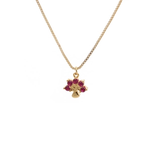 Golden box chain necklace with a tree pendant featuring red crystals on white background