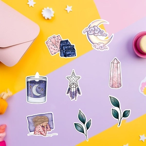 Flat lay of dream-themed colorful waterproof stickers with moon and clouds on stationery