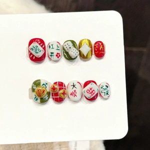 Handmade Mahjong press-on nails featuring lucky charms dice and red gold festive designs