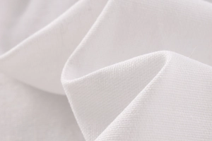 Detailed macro view of white linen blend fabric texture with natural weave pattern