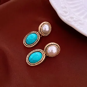 Vintage style oval pearl and green stone earrings in antique gold frame for women