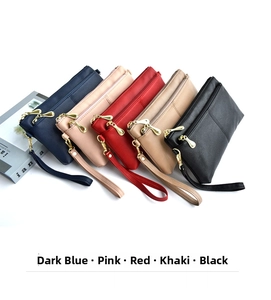 Set of five elegant PU leather wristlet bags in diverse colors with golden zippers
