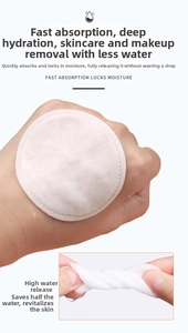 Detail showing the absorbency and size of round cotton pads with embossed edges