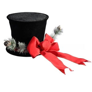Detail of black velvet Christmas top hat with red bow, pine needles and mini pine cones