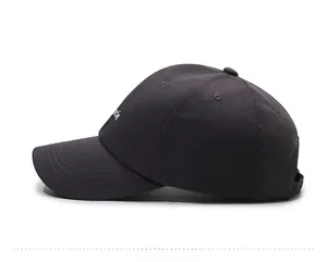 Detailed side view of dark grey cotton baseball cap featuring white letter embroidery