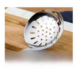 Close-up of stainless steel slotted spoon with wooden handle for draining oil from food