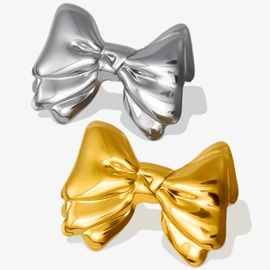 Detailed view of 304 stainless steel bow earrings in polished gold and silver finishes