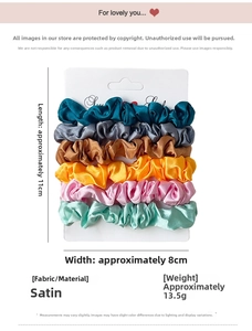 Detail of 6-piece satin scrunchies set in assorted colors on a white display card