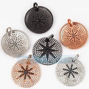 Detail showing micro-pave zircon charms in silver, rose gold, and black star motifs