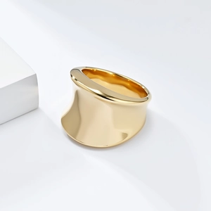 Minimalist wide gold-plated stainless steel ring with polished mirror finish and flared edges
