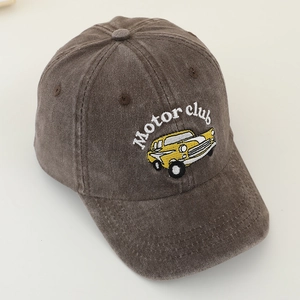 Close-up of vintage brown corduroy baseball cap with yellow classic car and Motor Club embroidery