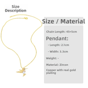 Macro detail of hummingbird pendant necklace with heart zircon and dimensions