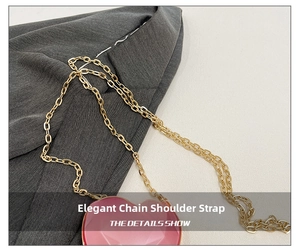 Detail of pink heart-shaped bag featuring a refined golden metal chain shoulder strap