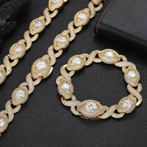 Macro view of gold hip hop eye links with sparkling cubic zirconia on cuban chain necklace