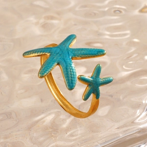 18K gold plated stainless steel starfish ring with turquoise enamel and wavy glass background