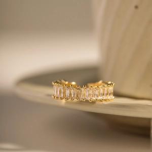 Detailed macro shot of 18k gold plated ring with sparkling square-cut cubic zirconia