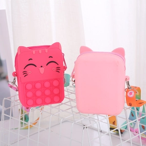 Detail of pink cat silicone pop purse with colorful cartoon patterns on shoulder straps