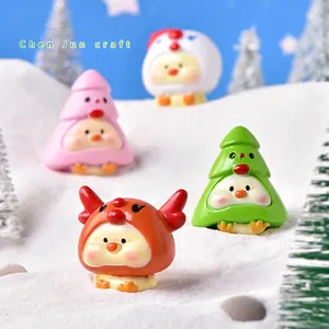 Miniature Christmas resin figurines set featuring cute festive chicks on snow background