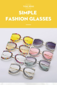 Detail view of colorful rhinestones on oversized metal sunglasses in eight different colors