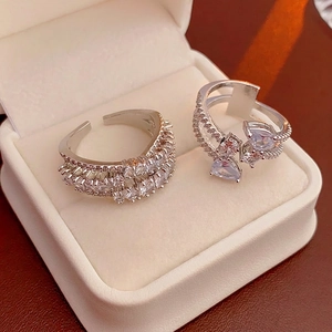 Silver layered zircon rings with teardrop and rectangle cut stones in a luxury box