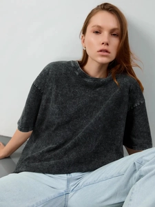 Detail view of charcoal gray oversized cotton T-shirt with vintage acid wash texture