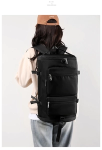 Rear view of a black high-capacity waterproof travel backpack with multiple pockets and straps