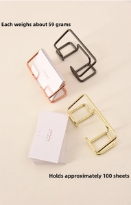 Golden metal card holder details showing 59g weight and 100-card storage capacity