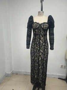 Close-up of black lace dress featuring a sweetheart neckline with eyelash lace detailing