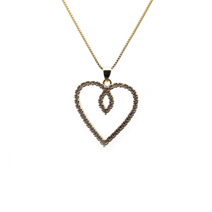 Gold heart pendant necklace featuring sparkling micro-pave zircons on a white background