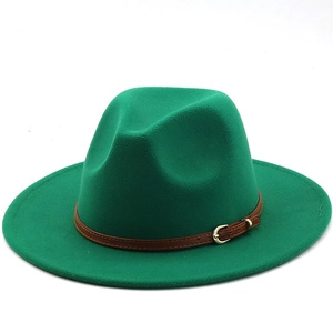 Close-up of emerald green wool fedora hat with brown leather strap and gold buckle