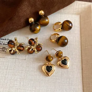 Vintage tiger eye earrings with gold-plated heart and floral charms in a set