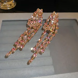 Elegant long tassel earrings with pink and white crystals in 18K gold plated finish