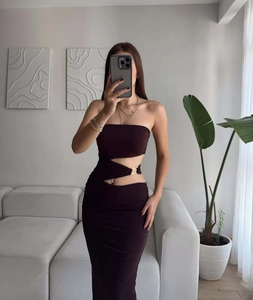 Detail of chocolate brown bodycon maxi dress with side cut-outs and metal ring hardware