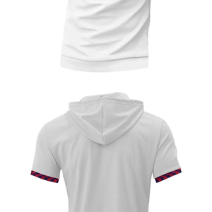 Detail view of white waffle knit hooded polo shirt showing back hem and sleeve cuff