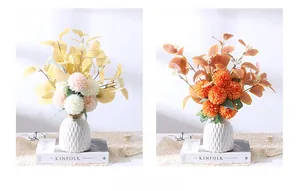 Modern white ceramic vase shown with two different artificial floral bouquet arrangements