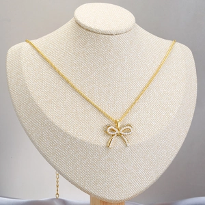 Elegant gold-plated double-layered necklace featuring a pearl bow pendant for women
