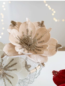 Close-up of velvet magnolia with gold glitter and sequins for Christmas decoration