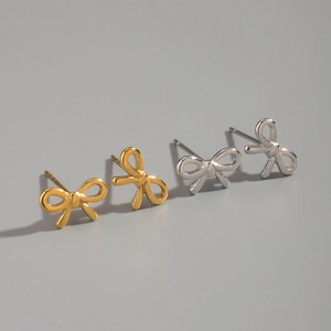 Detailed view of elegant bow-knot stud earrings in gold and silver stainless steel