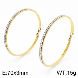 Detailed view of 70mm gold hoop earrings with white rhinestones and size measurements